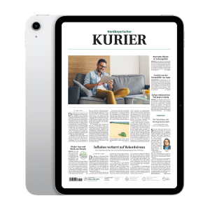 Tablet displaying the Nordbayerischer Kurier front page with a man reading on a couch tablet in his living room